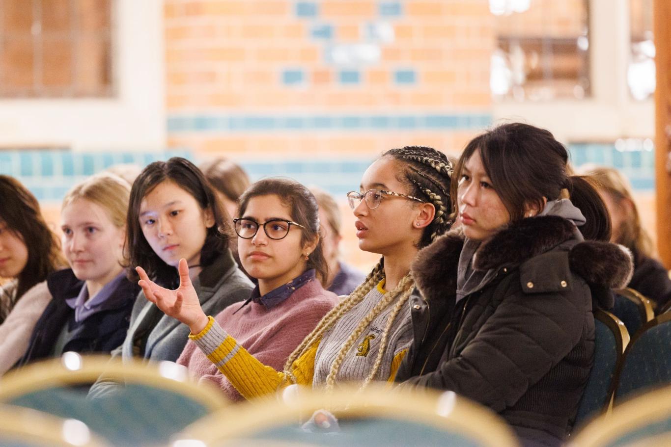 A pupil asks a question during a talk at Cheltenham Ladies' College