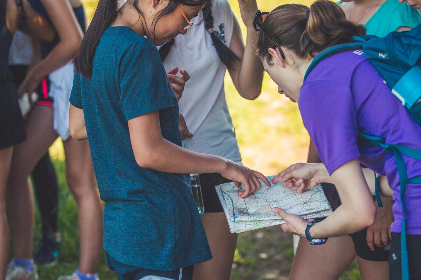 Students reading a map on a Cheltenham Ladies' College outdoor adventure day