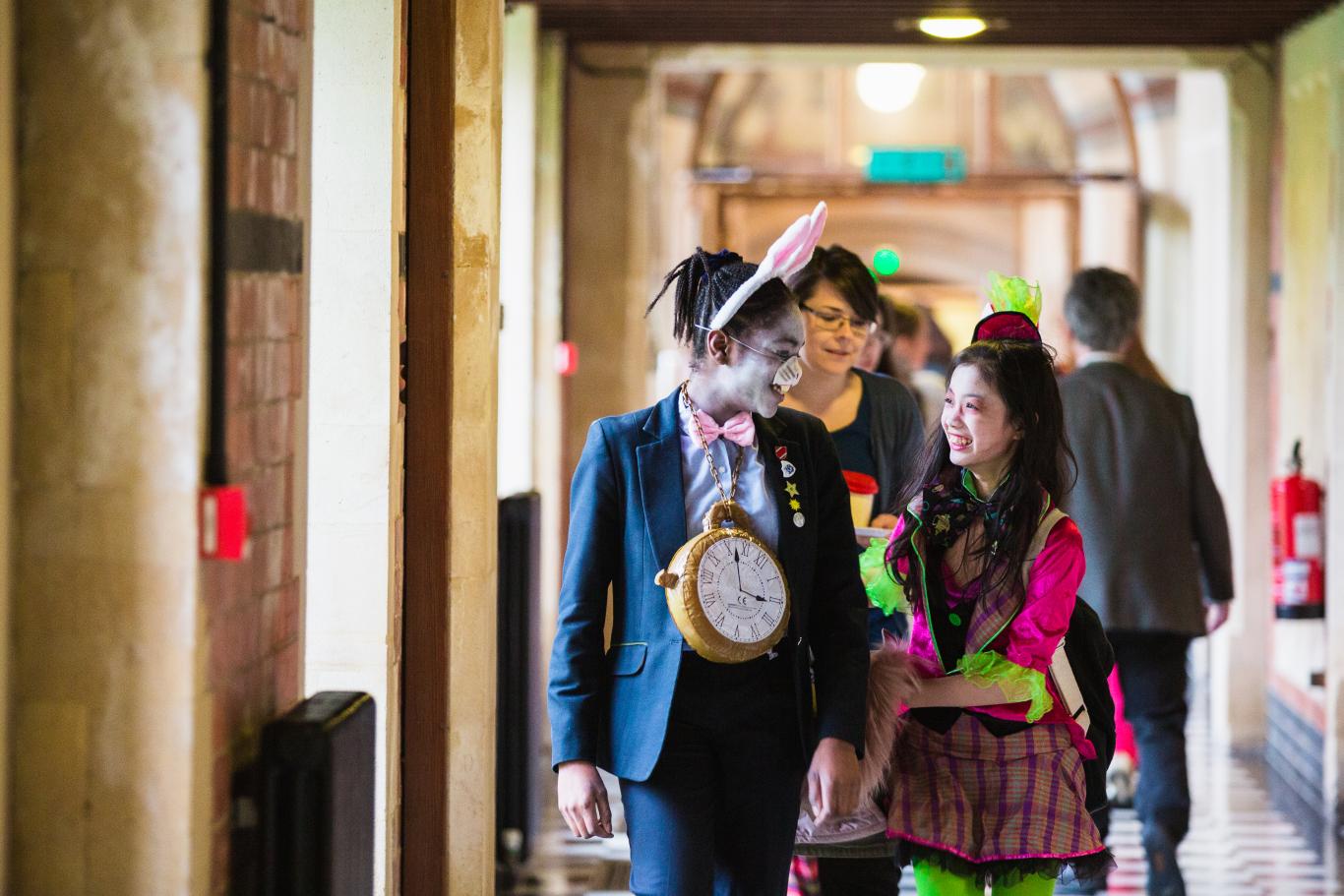 Cheltenham Ladies' College pupils walk down the Marble Corridor in fancy dress for World Book Day