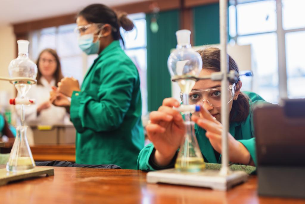 A pupil is conducting an experiment during an sixth form Chemistry lesson