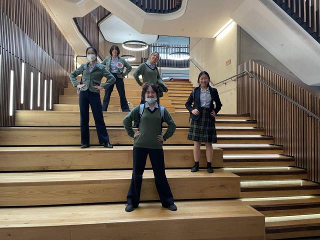A group of five CLC students posing on the steps at Oxford University