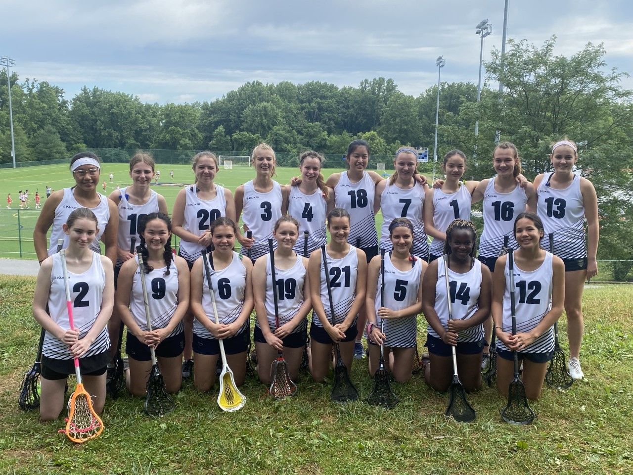 CLC Lacrosse USA Tour Squad: 17 students in two rows wearing Lacrosse kit