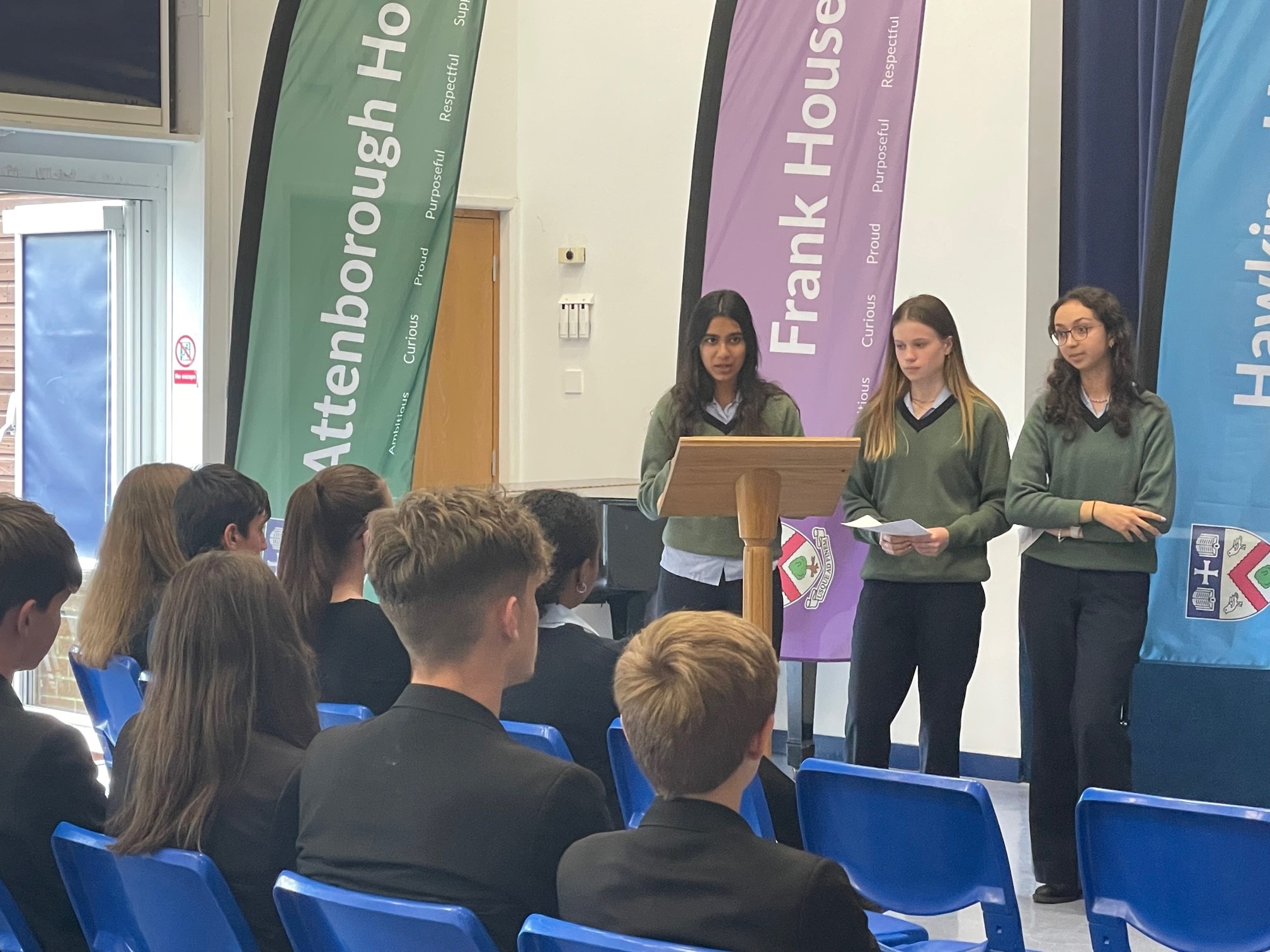Three CLC students giving their presentation